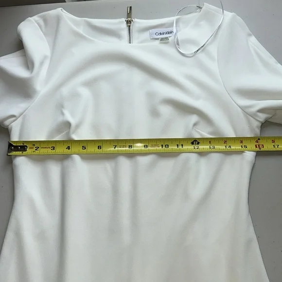 Elegant Calvin Klein White Dress with Flared Sleeves. - Picture 10 of 15